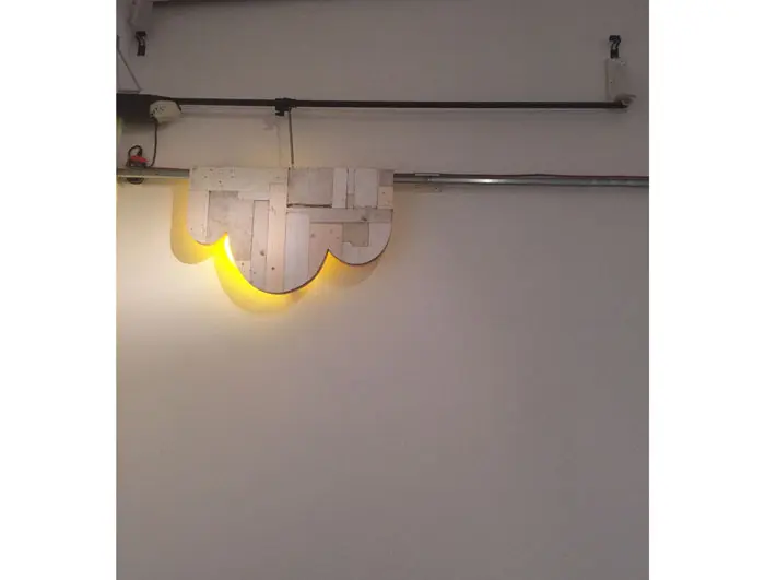 Patrick Renner created the breakthrough piece "Interval in Sunshine," 2015, which employs a garage door opener to propel its neon element. 