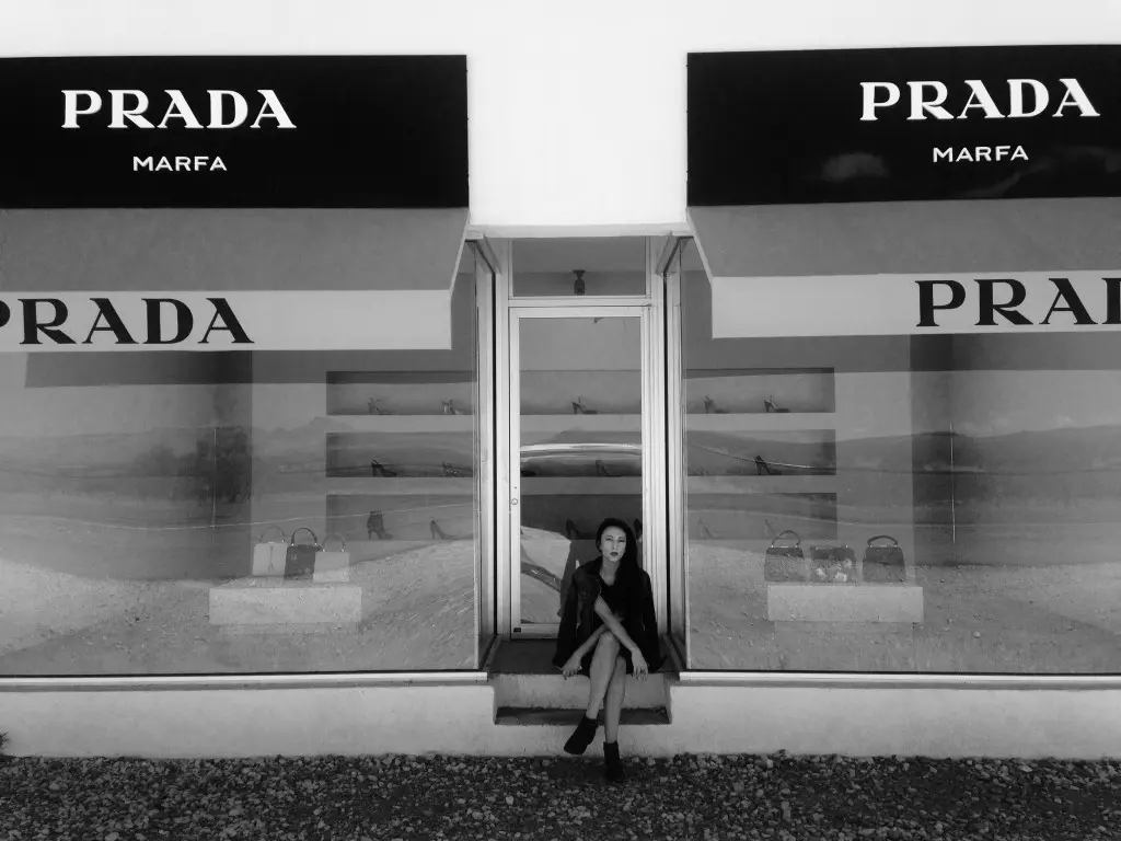 Liz taking a break at Prada Marfa, the only source of shade for miles