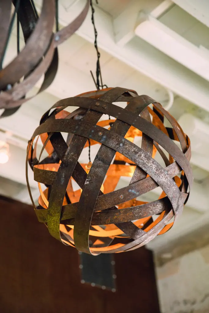 Craftsman Steve Walters formed these pendant chandeliers from metal barrel stays.