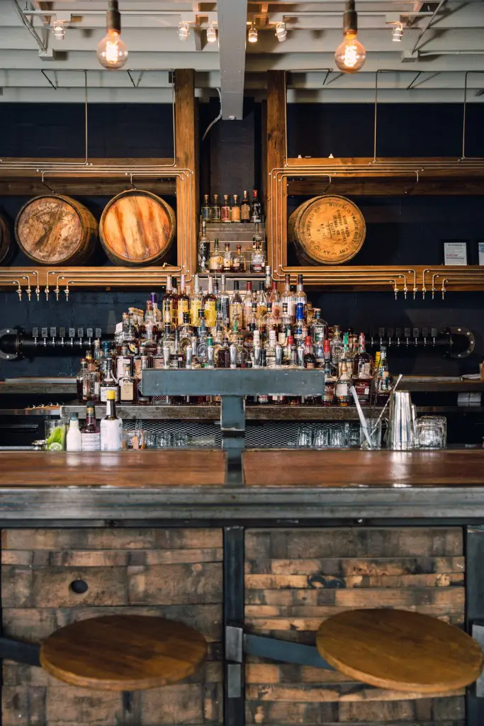 Bourbon barrels from distilleries in Kentucky and Colorado line the walls at Eight Row Flint.