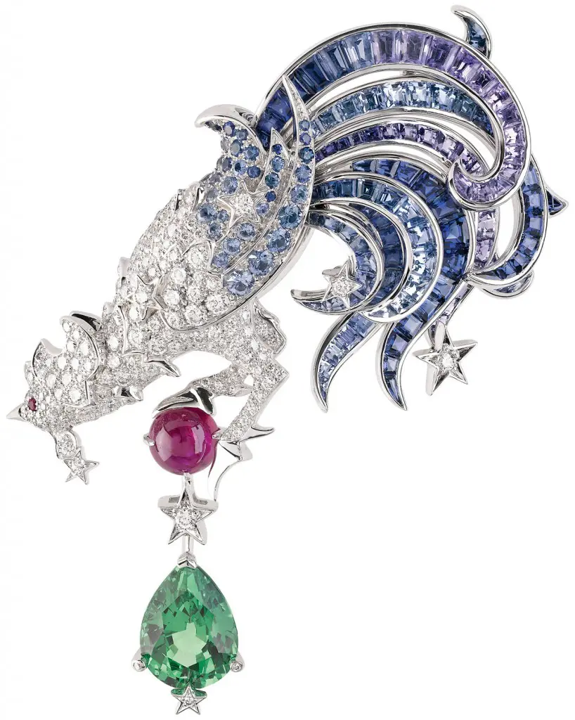 Van Cleef &
Arpels, Constellation
Coq clip from Voyages
Extraordinaires collection
with 4.41-carat tsavorine
garnet, 1.51-carat ruby, violet
sapphire, rubies, diamonds
and blue sapphires set in
18K white gold.
