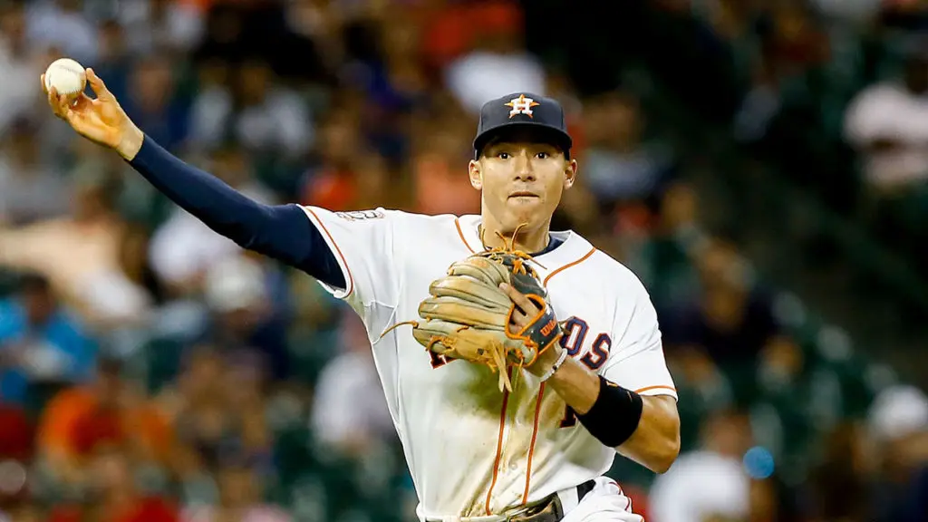 Carlos Correa looks to Stephen Curry for guidance.