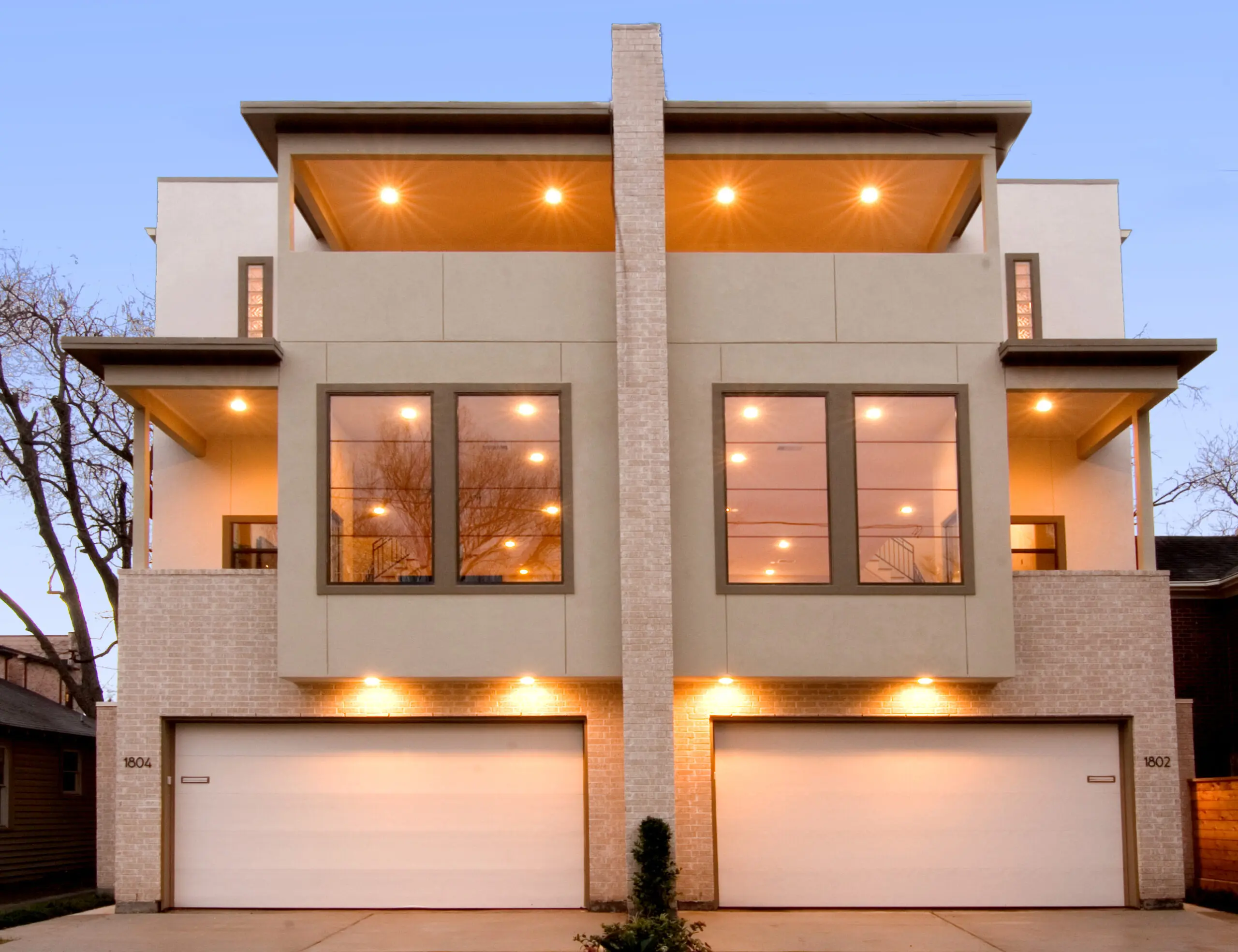 One of John Leggett's homes gleams with distinctive glass and lights.