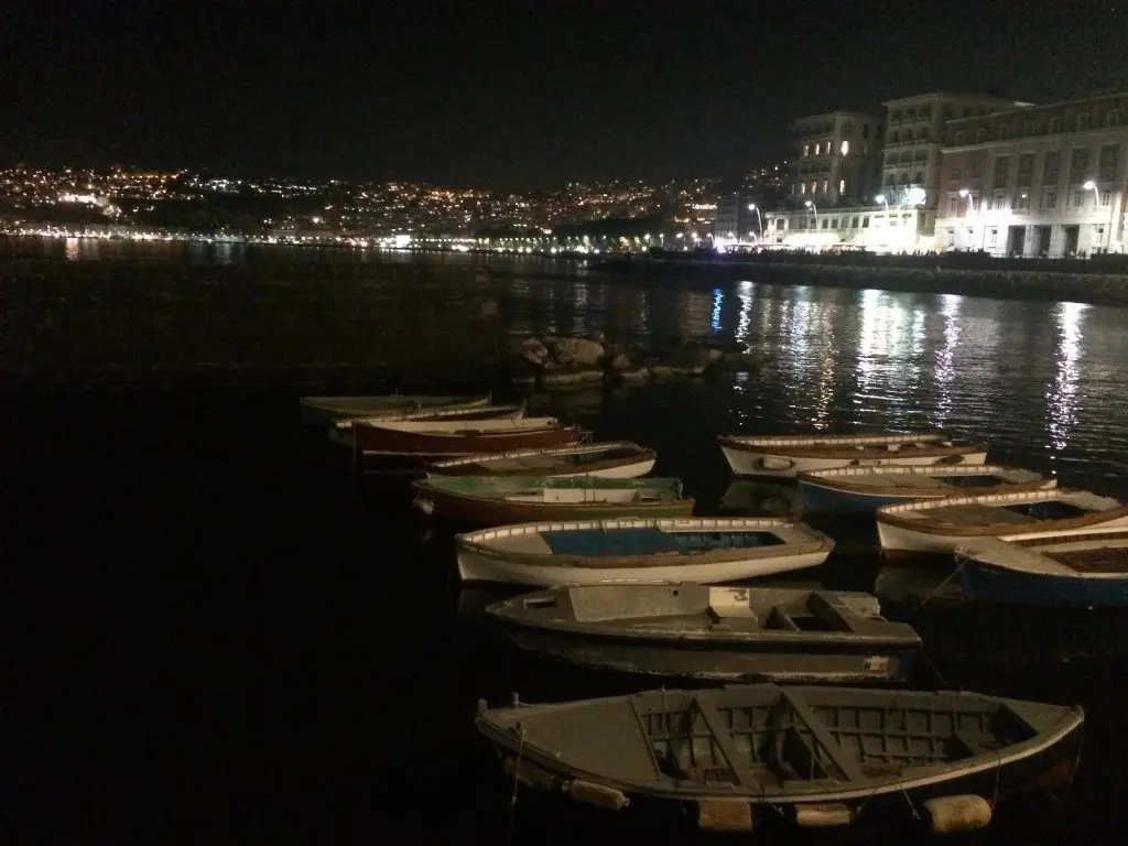 Bay of Naples glowing among the city lights. 