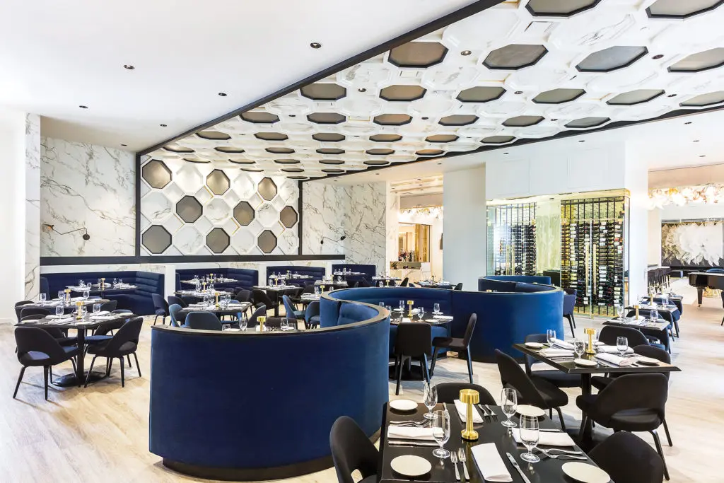 Designed Nina Magon of Contour Interior Design, 51Fifteen's new digs possess maximal glamour with a serpentine banquette. 