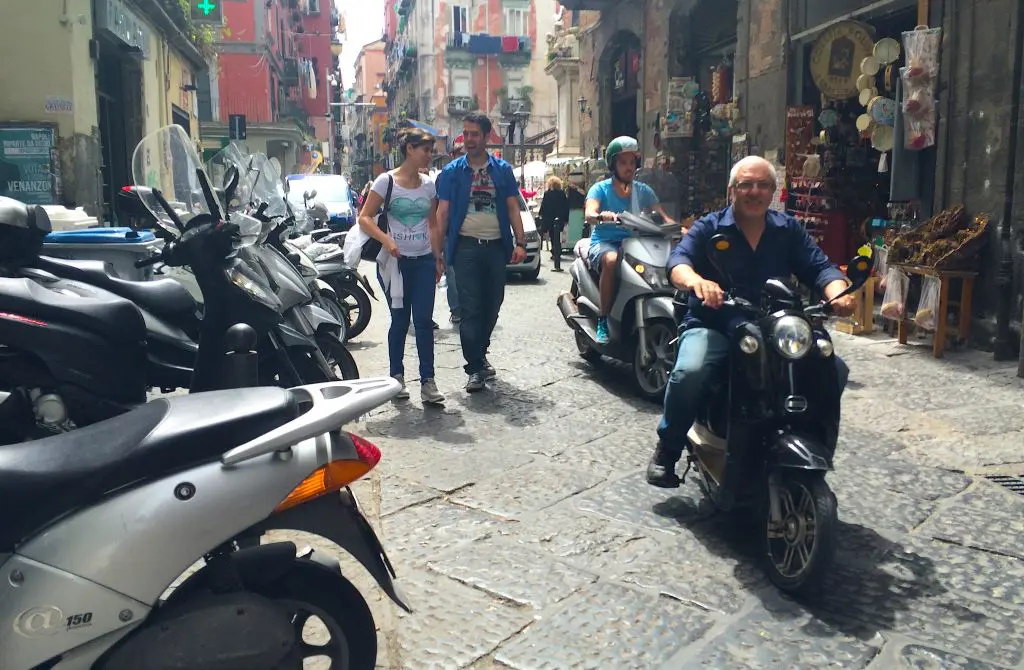 Vespas on narrow cobblestone streets