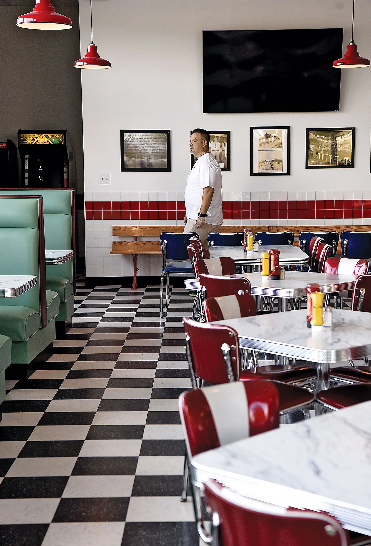 Owner Ronnie Killen surveys the scene in his Killen's Burgers.