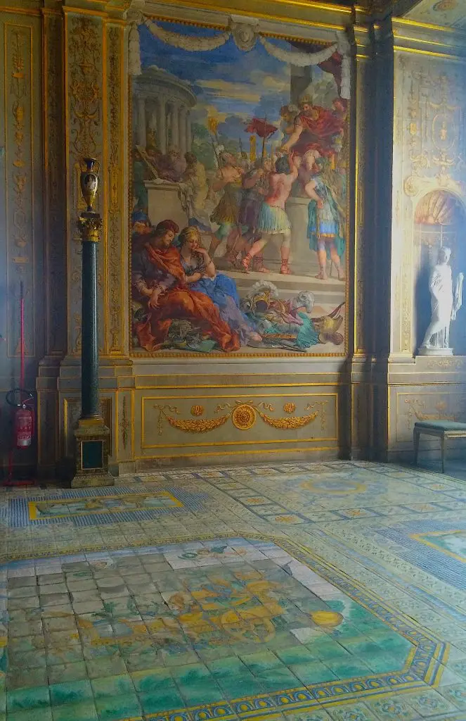 Majolica tiled floor in the Salla della Stufa. Wishing for less glare from sun streaming in the windows so one could better see the elaborate floor patterning.