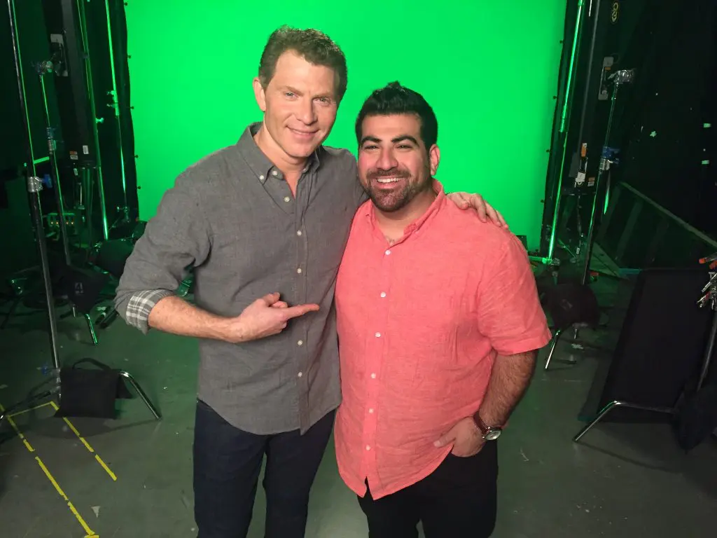 Bobby Flay points to Kevin Naderi, who schooled the Iron Chef in stuffed cabbage. (Photo courtesy Roost)