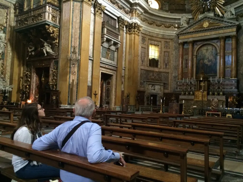 Earl and his granddaughter Arianne survey the high altar at The Gesu.