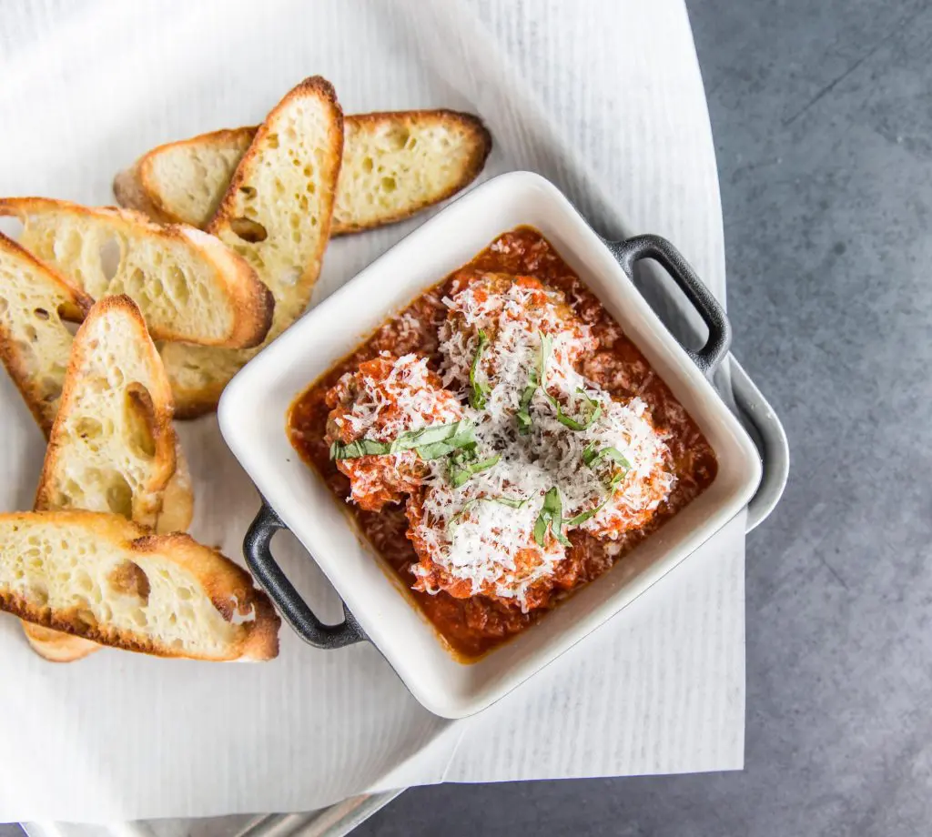 Pi Pizza's meatballs are smothered in a house-made marinara sauce sauce. 