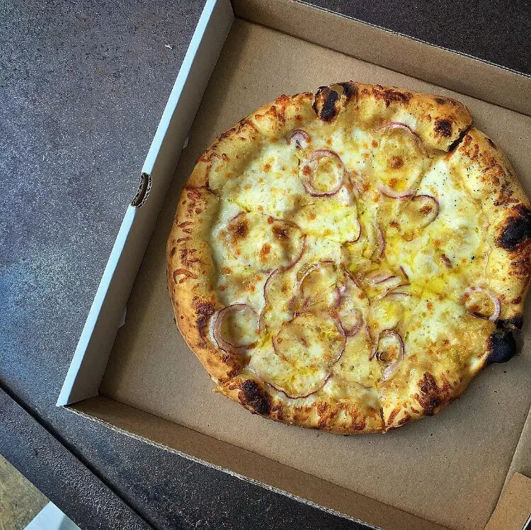 "Smoked Mozzarella, Caramelized Onion & Guanciale: Killer lunch from the @passprovisions team today during our @shakeshack Houston popup. Beyond incredible day!" — @mark_rosati