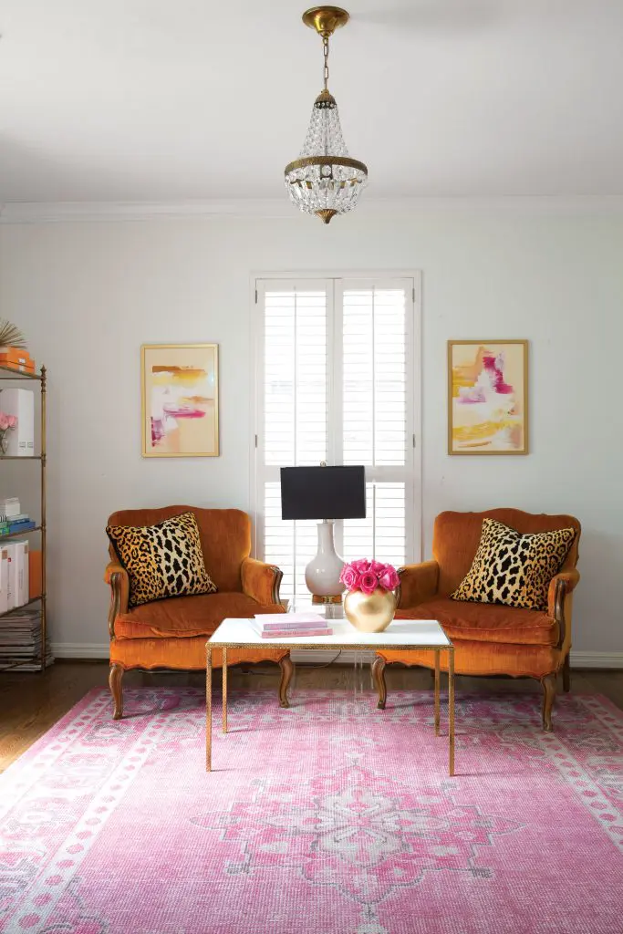 Knapp opted not to reupholster vintage orange chairs that belonged to her grandparents, given that orange is House of Harper's signature color. 