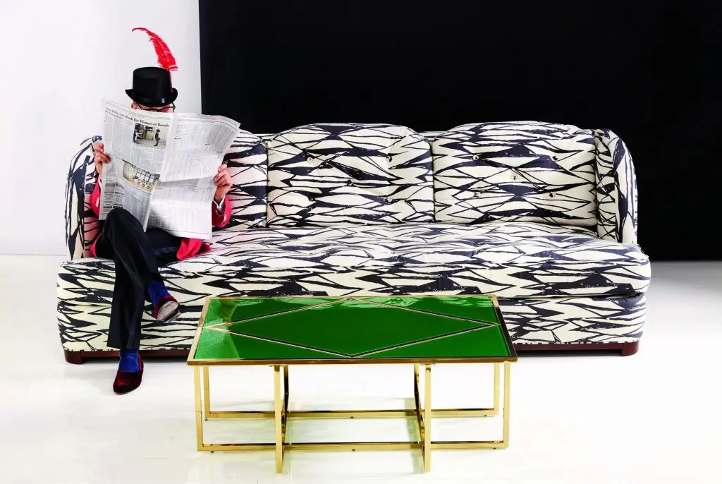 Miles Redd perched atop the Samuel sofa, accented with the Diamond coffee table