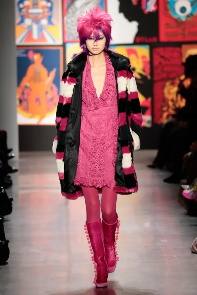 Anna Sui V-neck dress, striped coat, and boots laced with pom-pons. (Photo by Anna Sui)