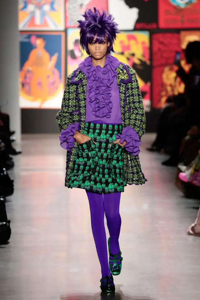 Anna Sui purple and green tweed coat, purple ruffled blouse, checked mini-skirt with pockets. (Photo by Anna Sui)