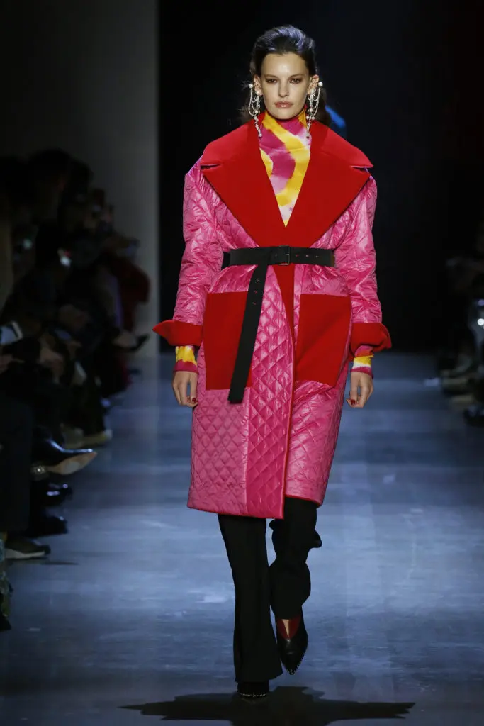Prabal Gurung pomegranate and ruby reversible quilted nylon and wool duvet coat with exaggerated portrait neckline, tie-dye cashmere knit turtleneck, ink crepe tailored trousers. (Photo by Prabal Gurung)

