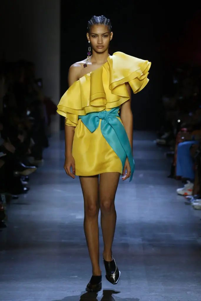 Prabal Gurung marigold silk gazar dress with hand-draped off-the-shoulder flounce and turquoise silk gazar sash. (Photo by Prabal Gurung)
