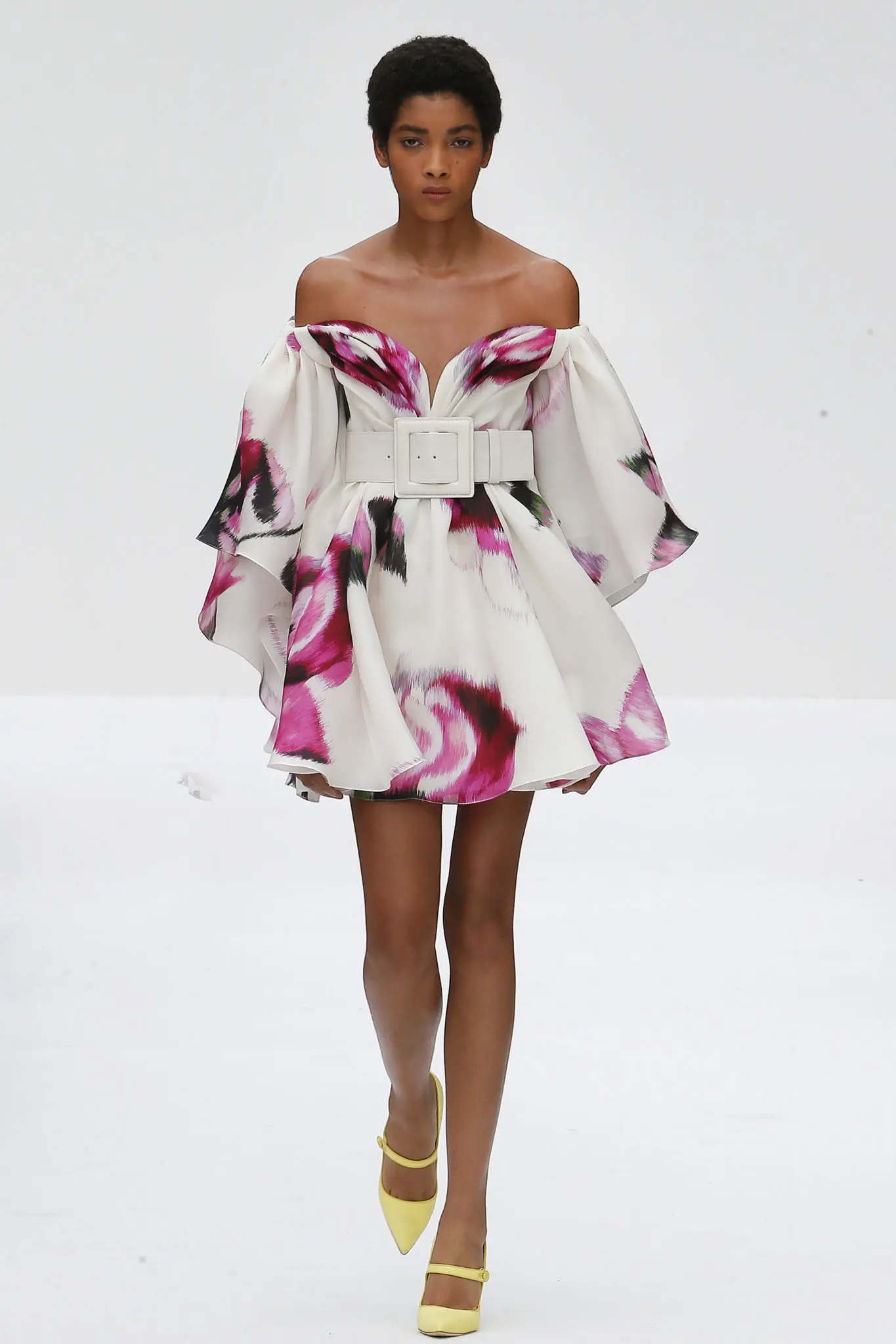 Carolina Herrera white gazar strapless mini-dress with drape ecru coated canvas wide belt. (Photo courtesy of Carolina Herrera)