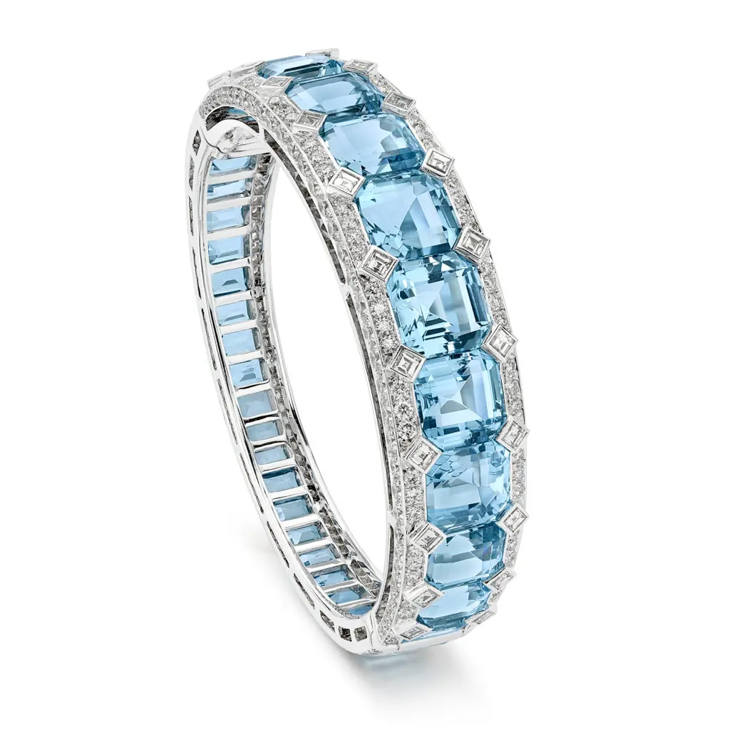 Icy Blue Bracelet with emerald cut aquamarines accented with diamonds, crafted in 18K white gold.