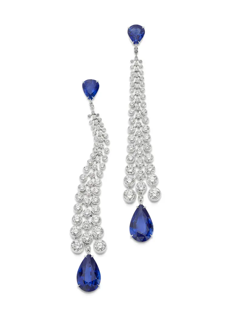 Sapphire Dangle Earrings with four pear-shape violet-blue sapphires dripping from three rows of diamonds.