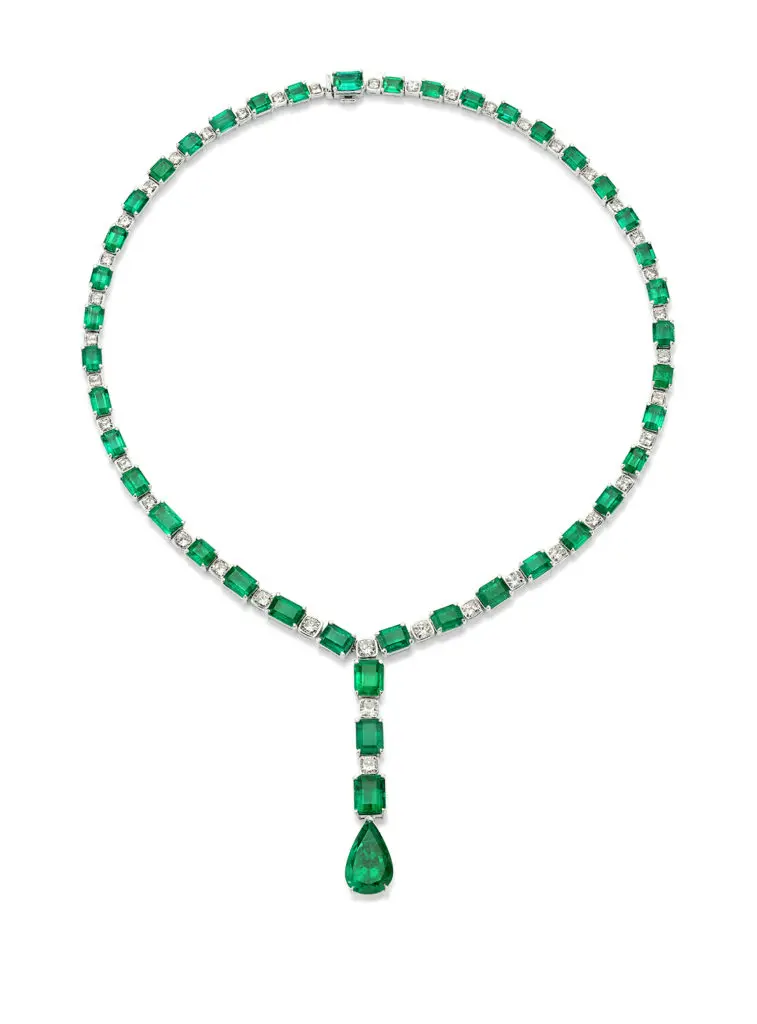 Maharaja Necklace featuring luscious emerald-cut and pear shape emeralds as well as diamonds set in 18K white gold.