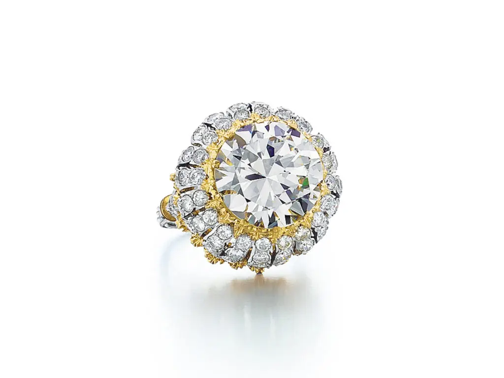 Estate Buccellati ring featuring a 7.86 carat diamond set in a handcrafted textured 18K yellow gold and platinum mounting with diamonds, circa 2000.