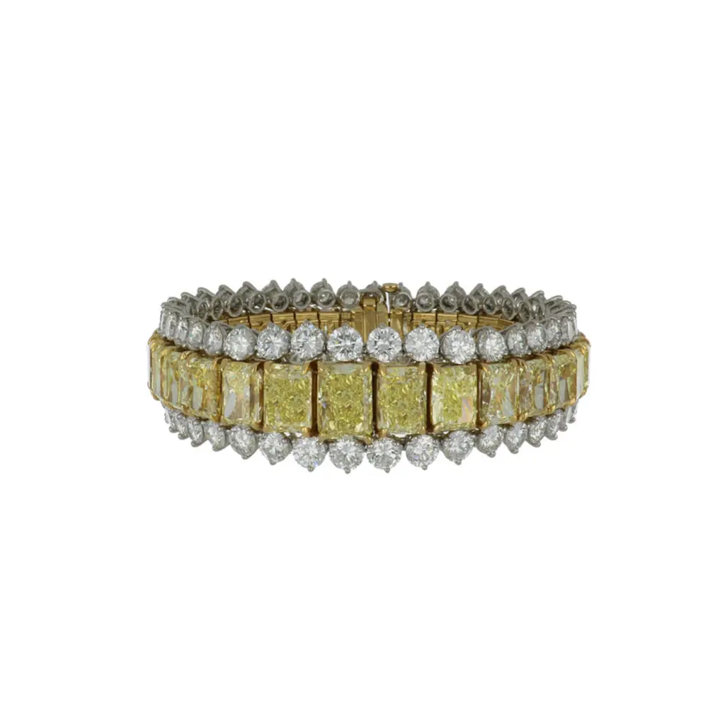 An important modern estate 18K yellow gold and platinum radiant-cut yellow diamond bracelet with round brilliant-cut diamonds.Circa 2000.