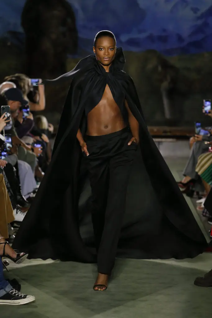 The cheering started as soon as the first model, clad in black satin slacks and a cape fastened at the neck exposing her midriff, came out. (Photo by Monica Feudi)