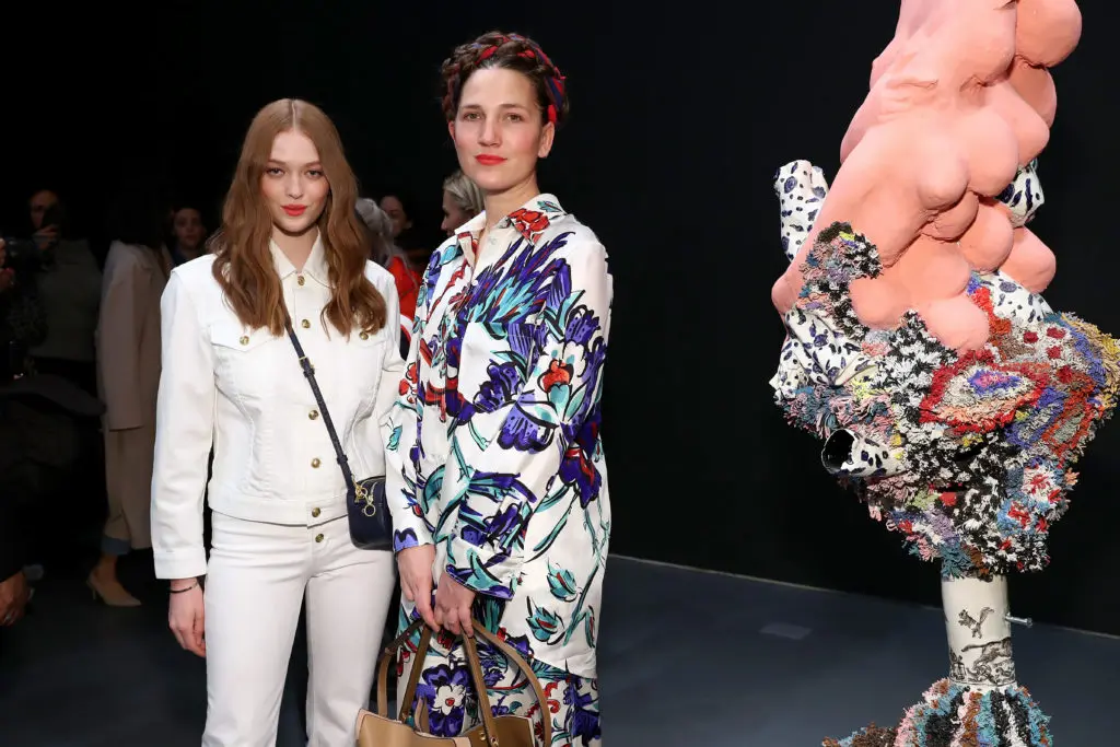 Artist Francesca DiMattio, right, was the inspiration for the Tory Burch fall collection. DiMattio posed with actress/model Larsen Thompson before the show. (Photo by Cindy Ord/Getty Images for Tory Burch)