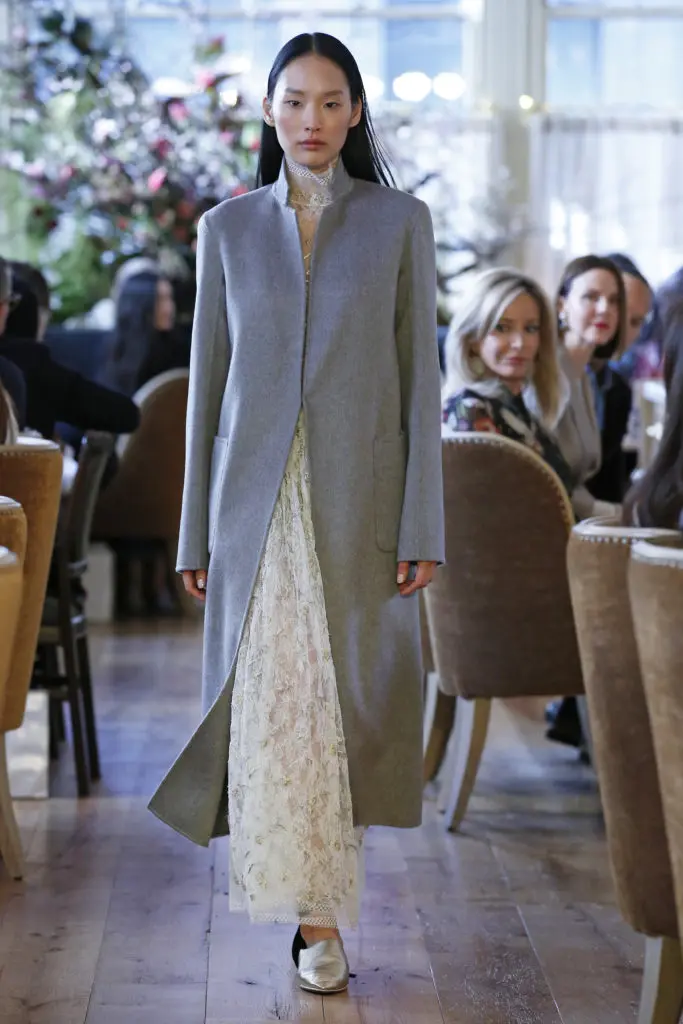 Adam Lippes ivory embroidered Chantilly lace turtleneck, ivory embroidered Chantilly lace gathered skirt, double face zibeline cashmere coat. (Photo by Dan Lecca)