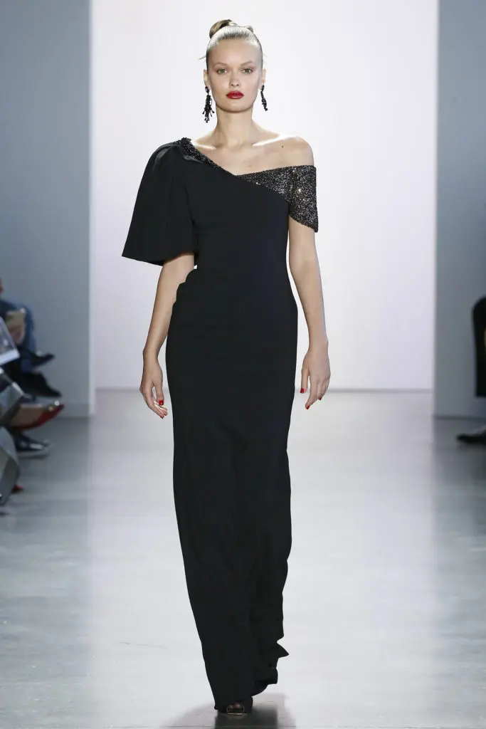 Badgley Mischka black gown with asymmetrical neckline and just a dusting of black sequins at the shoulders affirms the notion that sometimes simplicity is best. (Photo courtesy of Badgley Mischka)