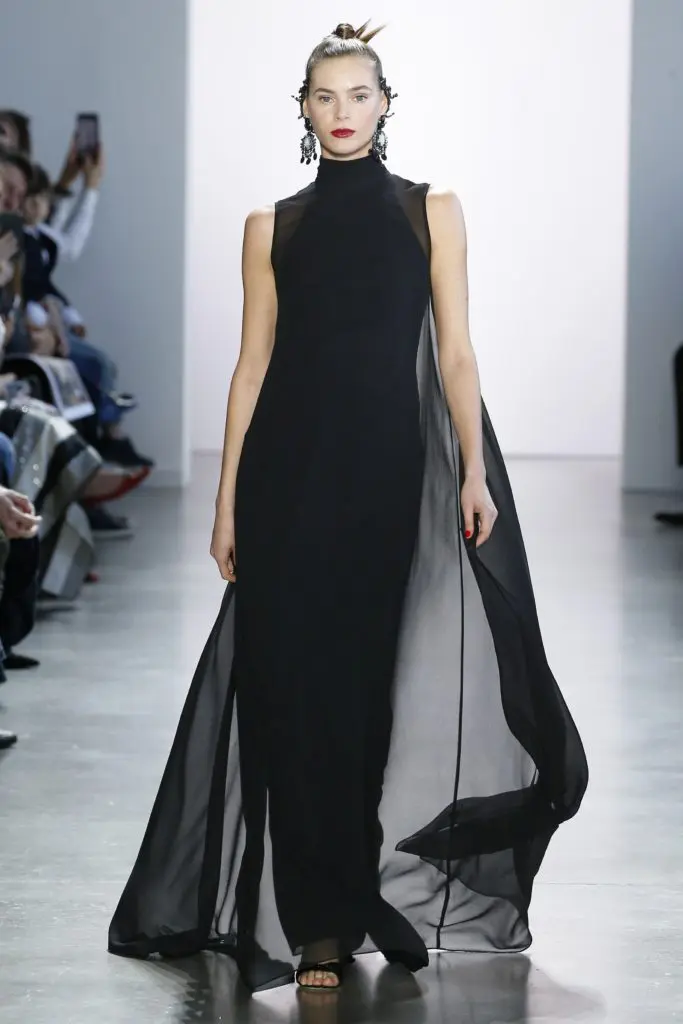 The most striking gown in the Badgley Mischka collection  — a high-neck, sleeveless all-black gown with an intricate lace back and train — doesn't have a sequin or bead on it. (Photo courtesy of Badgley Mischka)