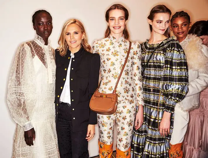 Backstage, Tory Burch poses with several models in looks from her fall runway collection. (Courtesy of Tory Burch)