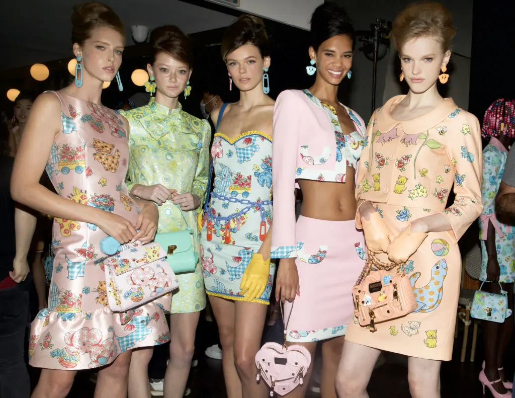 Rainy Runway, Bright Clothes and A-List Celebs — Moschino’s Risky Outdoor Show is a Soggy Delight