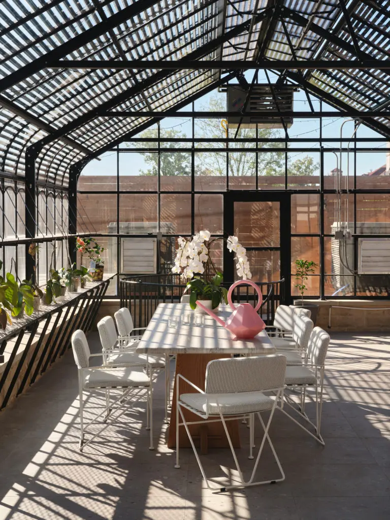 Christy Berry's backyard greenhouse is a vaulted thing of beauty. (Photo by Lisa Petrole)