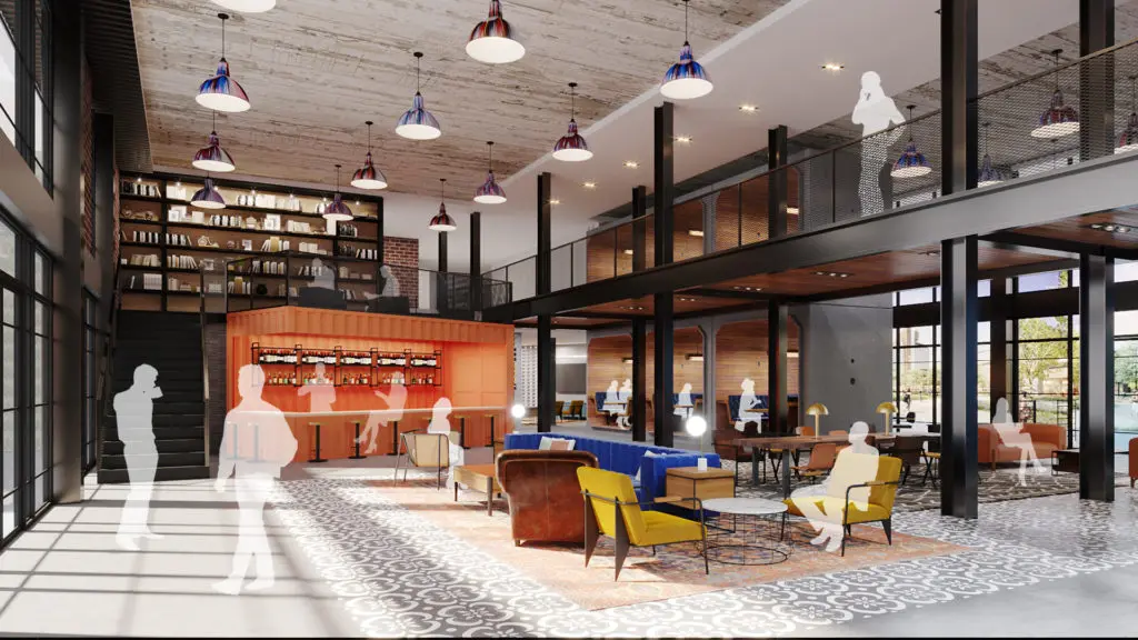 The two-story lobby at The Laura at East River is designed as a gathering space with a coffee bar.