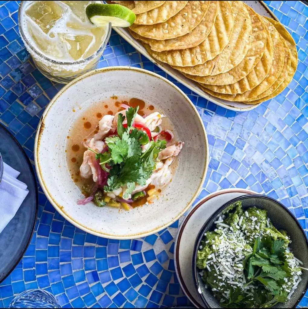 Tinie's serves up fresh guacamole with crispy fried tostadas and shrimp ceviche to die for.