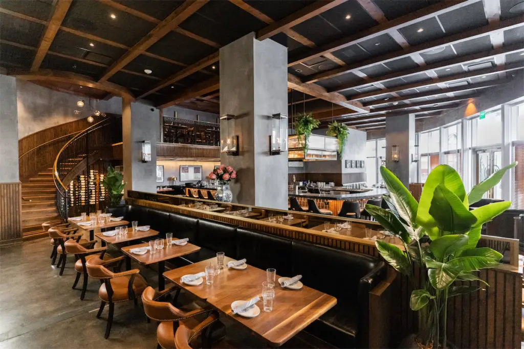 Ramble Room features a horseshoe covered in leather marble and multi-floor seating. (Photo by Kathy Tran)