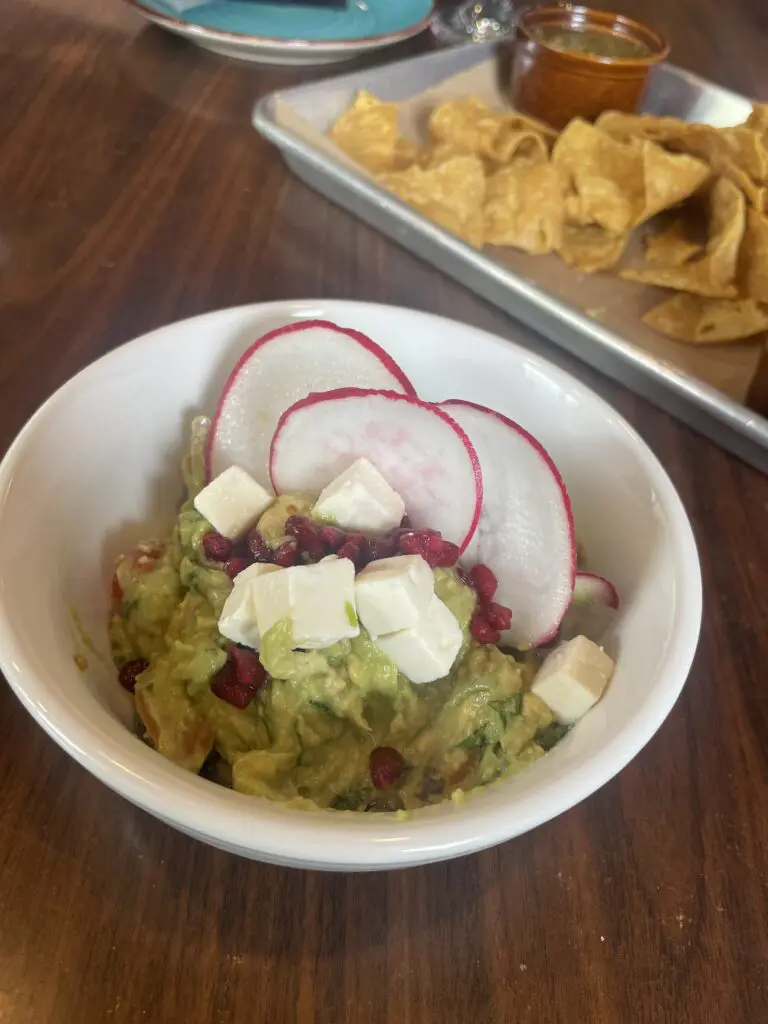 With radish, cubed queso fresco and pomegranate seeds, Uli's Kitchen brings a unique take on guacamole.