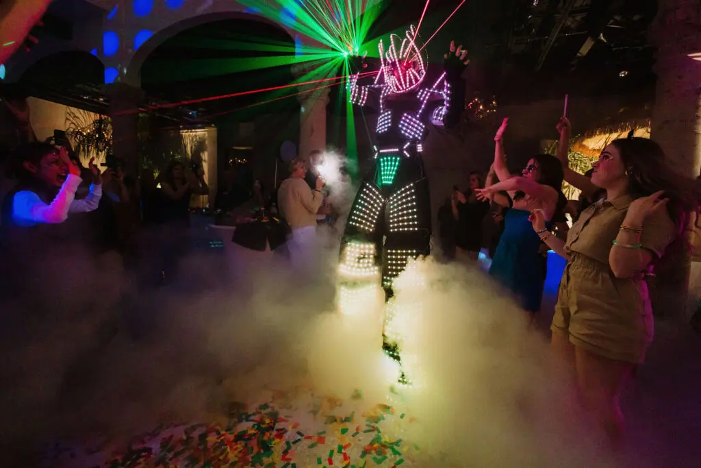 The evening culminated in a spectacular countdown, with endless confetti soaring up to the high ceilings and a giant robot with lasers shooting out of its eyes taking center stage.