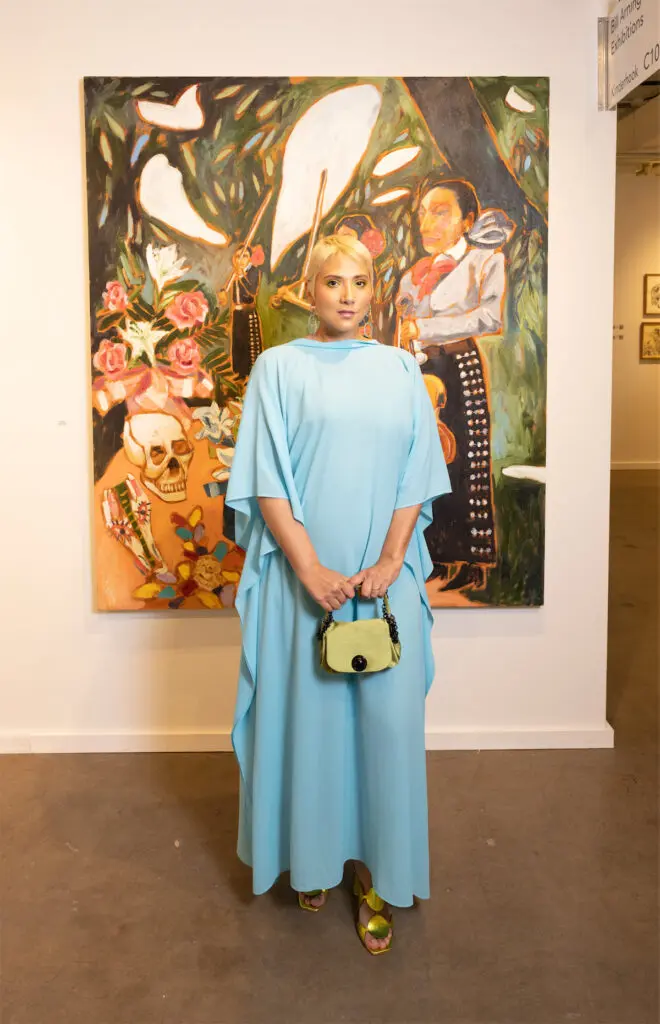 Olivia Ortiz with Cruz Ortiz's cuando i hear amor eterno i cant help but cry, 2022 at Dallas Art Fair (Photo by Exploredinary)