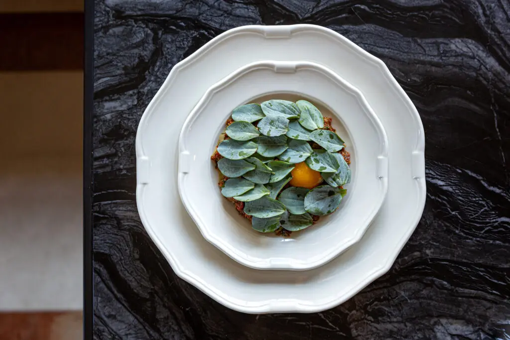 Both the steak tartar ($28) at Andiron and its bluefin tuna ($28) counterpoint are a mixture of ground and chopped flesh. (Photo by Jenn Duncan)