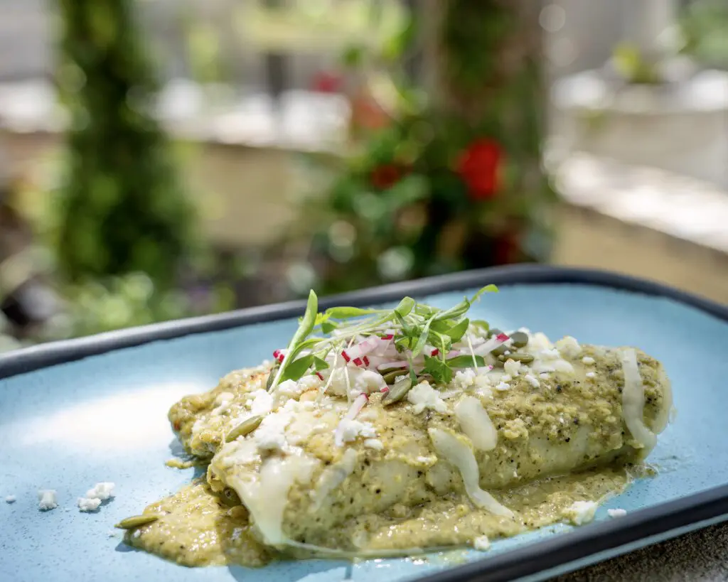 Suizas Enchiladas made with a creamy green salsa, tomatillos, jalapeños and onion are a Verde Garden staple. (Photo by Dustyn Zenner)