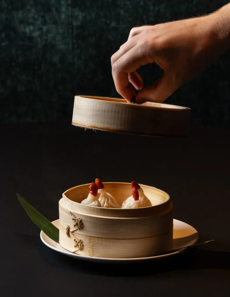 Starters include time-intensive XLB (Xiao Long Bao) soup dumplings, filled with minced pork and tiny cubes of gelatinized broth that melt as the dumplings are steamed. (Photo by Norton Creative )