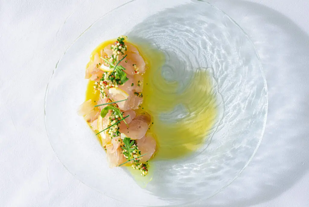 Begin your repast at Pastore with slices of the cured Gulf snapper, a light, bright dish created with the perfect touch of acidity, care of lemon oil balanced with Castelveltrano olives and fresh fennel ($15). (Photo by Doc Hoang)
