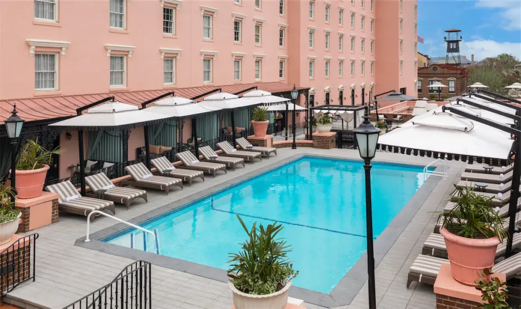 The renovated rooftop pool and terrace at The Mills House offers an outdoor bar and cabanas. (Courtesy of The Mills House)
