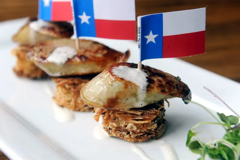Tim Loves own rabbit-rattlesnake sausage served at his iconic Lonesome Dove Western Bistro.