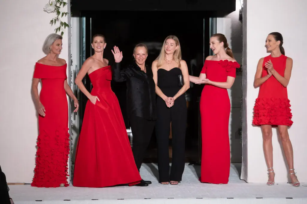 Vancouver-based designers Catherine Regher and Eva Regher with their models on the runway at the Elizabeth Anthony Go Red for Women fashion event. (Photo by Daniel Ortiz)