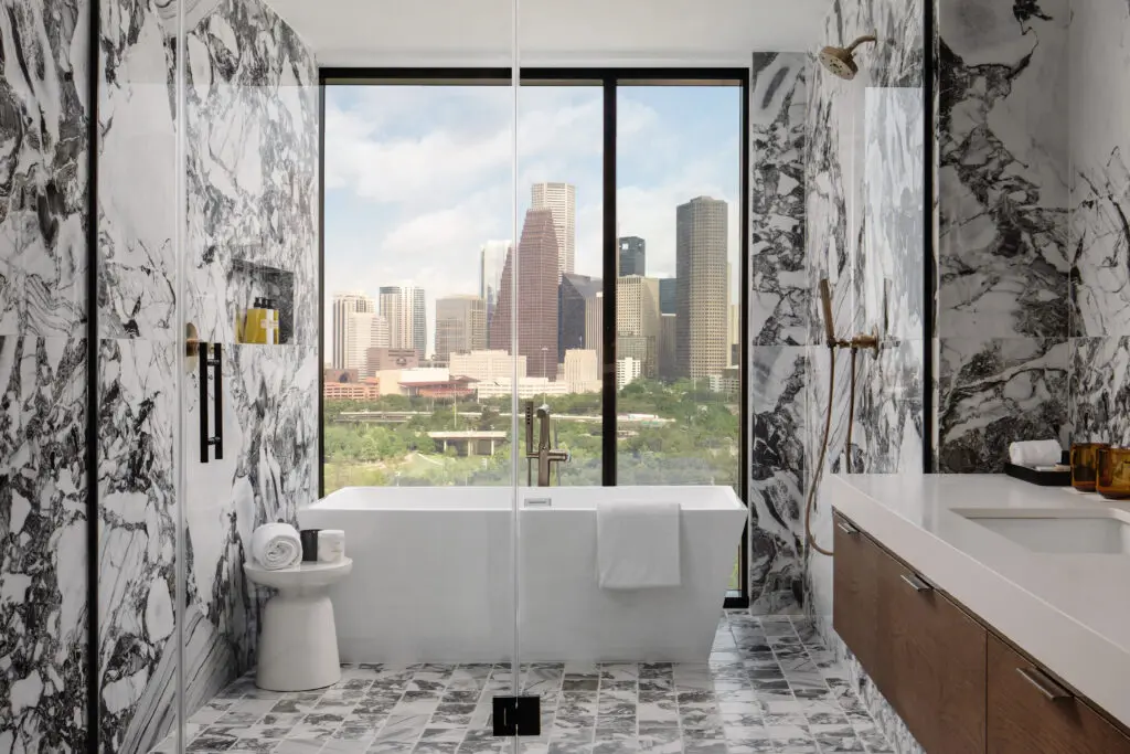 A bathroom with a view from the Skyline Suite at the Thompson Houston hotel which is taking reservations now for is December 21 opening.  (Photo by Thompson Houston)